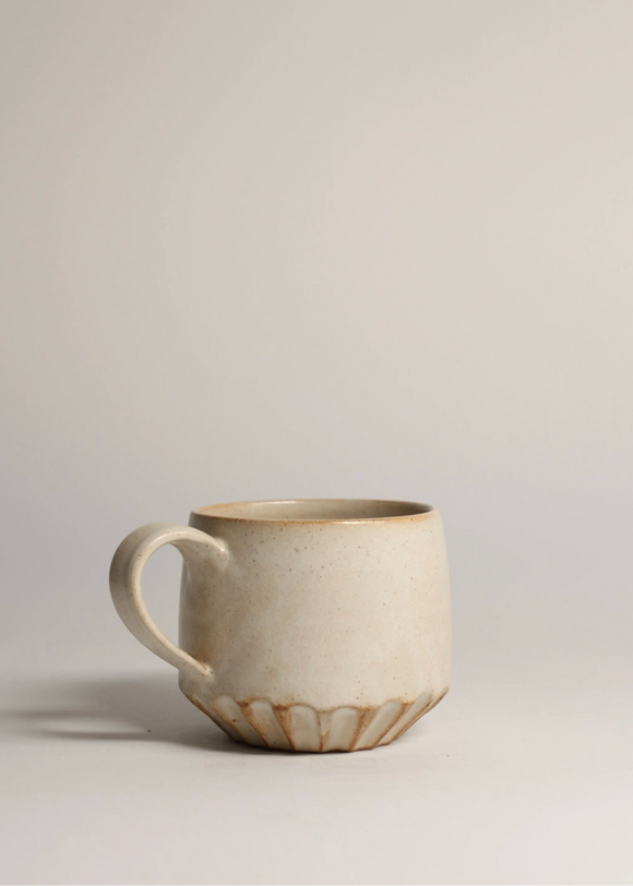 Ceramic mug on a plain background