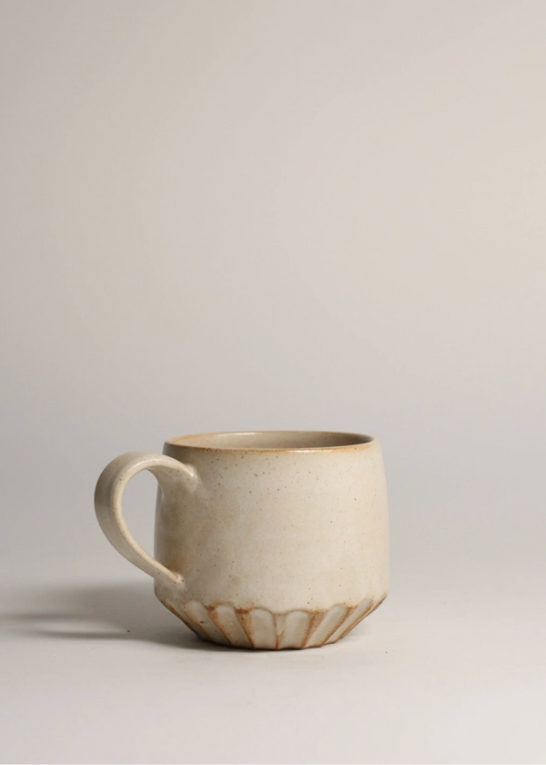 Ceramic mug on a plain background