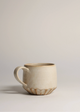 Ceramic mug on a plain background
