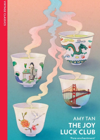 Book cover of 'The Joy Luck Club' by Amy Tan with illustrated teacups and colorful, traditional Chinese design.