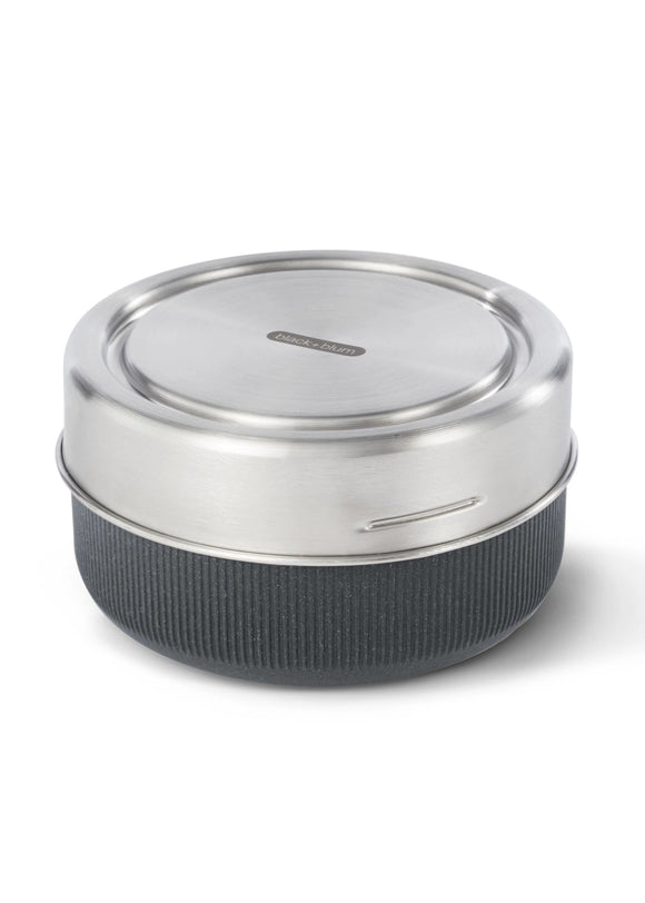 Silver and black container with lid on a white background