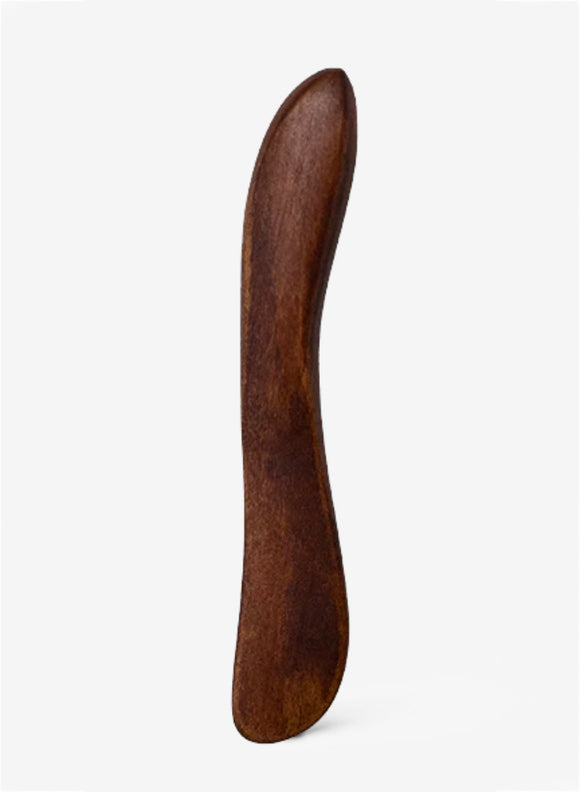 Wooden shoe horn on a white background