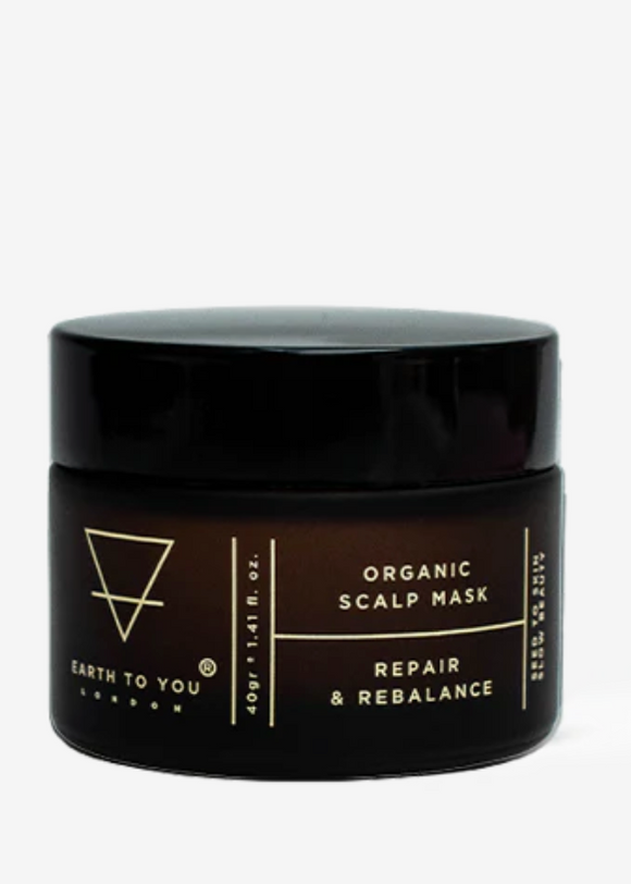 A jar of Earth to You Organic Scalp Repair Mask, which is designed for hair care and appears to be made with natural ingredients.