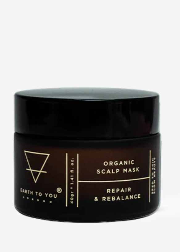 A jar of Earth to You Organic Scalp Repair Mask, which is designed for hair care and appears to be made with natural ingredients.