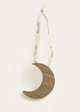 decoration with a wooden crescent moon pendant on a white background