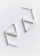 Pair of geometric triangle earrings on a light gray background