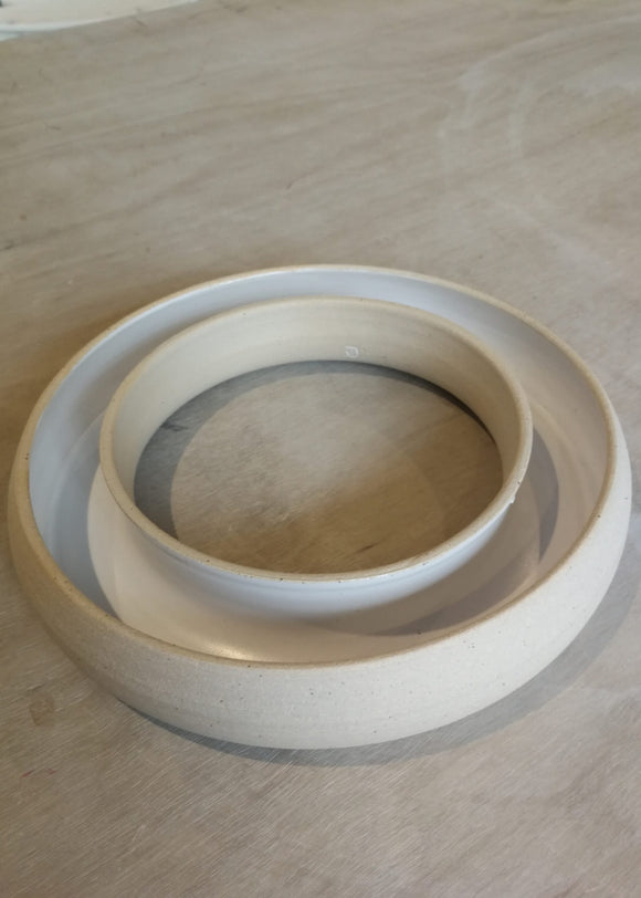 ceramic ring on a light wood surface