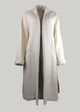 Long beige coat on a white background
