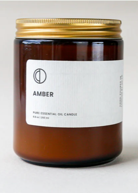 octo amber scented candle in a amber glass jar