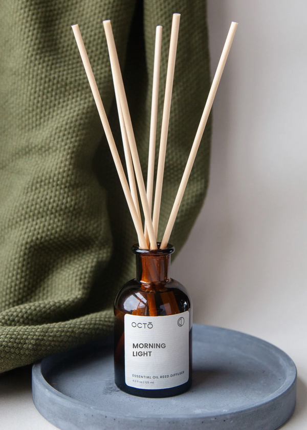 octo reed diffuser in a brown glass bottle 