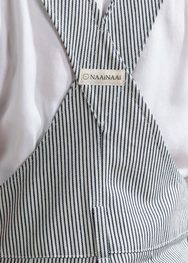 Black and white striped dress with a brand label on a light background