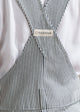 Black and white striped dress with a brand label on a light background