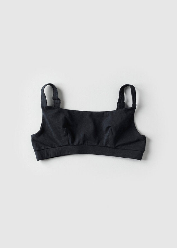 A beige organic cotton full crop top with covered adjustable straps and underband, displayed against a neutral background.