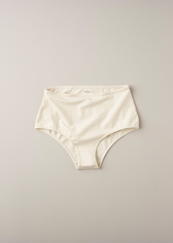 A pair of high-waisted beige organic cotton knickers with binding at the waist and legs.
