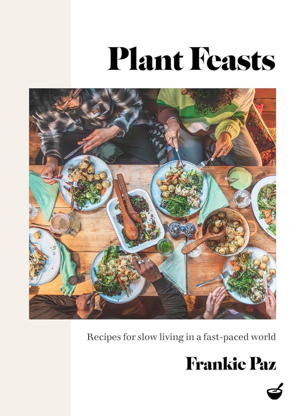 Book cover of 'Plant Feasts' with people around a table eating a meal.