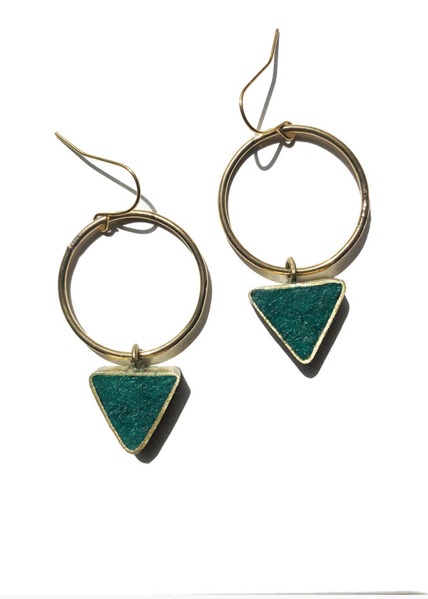 Gold hoop earrings with green triangle pendants on a white background