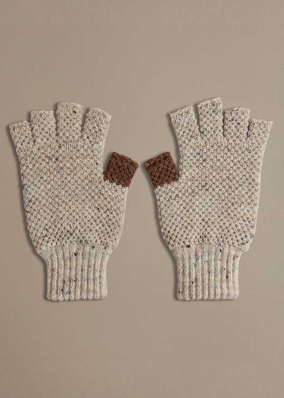 Pair of knitted fingerless gloves with brown accents on a beige background