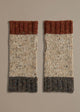 A pair of Donegal wrist warmers with beige, gray, and red color blocks, laid flat on a neutral background.