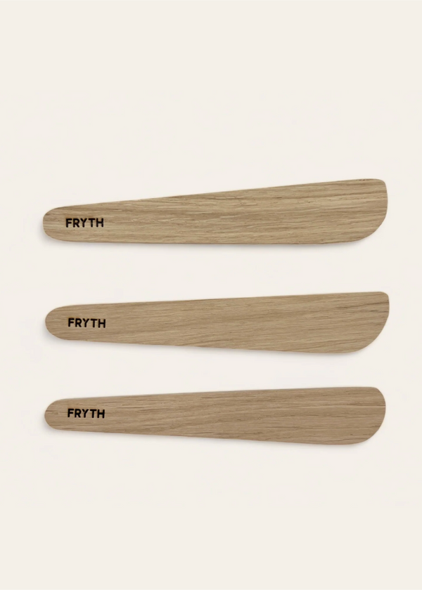 Three wooden spatulas with 'Fryth' branding on a beige background