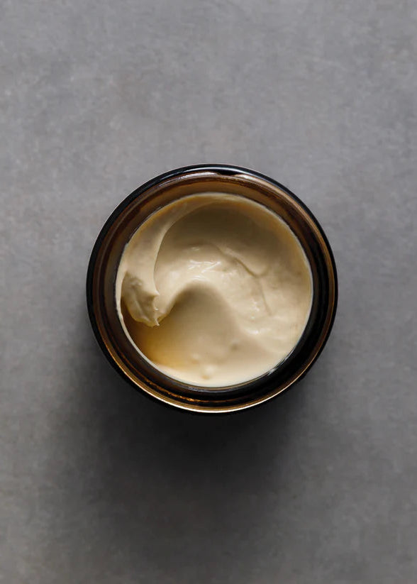 Jar of cream on a gray background