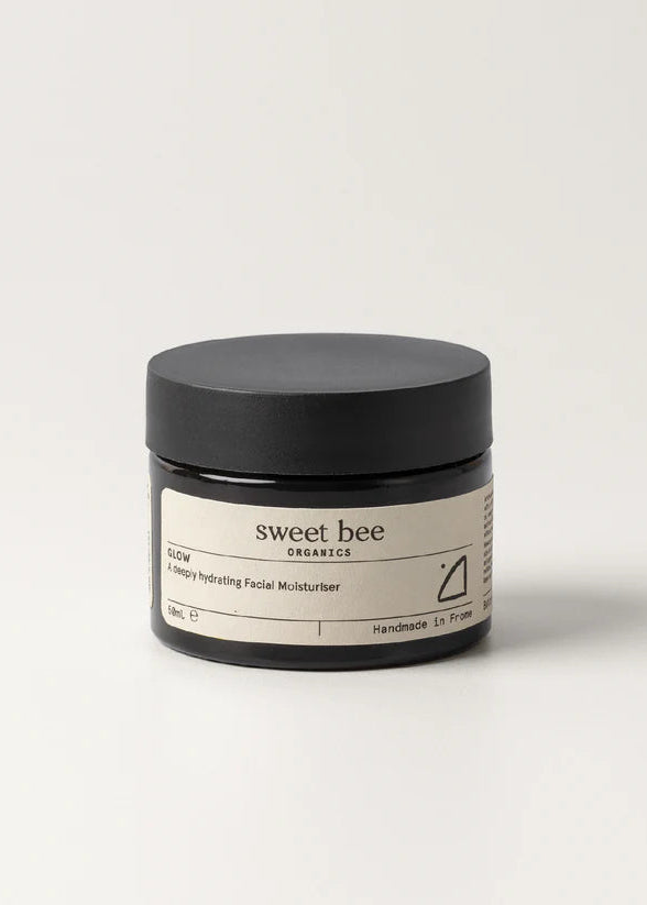 Jar of 'sweet bee' skincare product on a white background