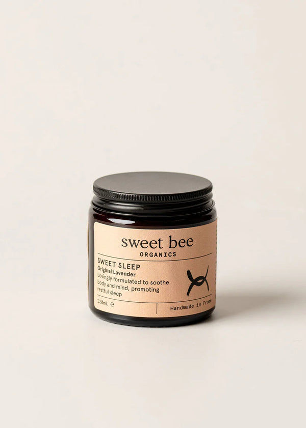 Jar of 'sweet bee' organic product on a beige background