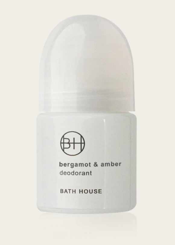 Bergamot & Amber Deodorant by Bath House in a white roll-on bottle with black and green label.