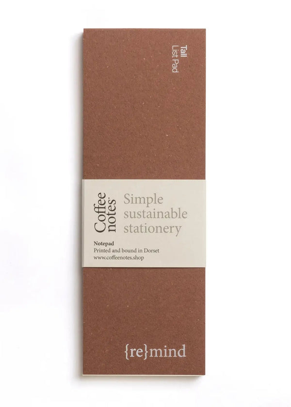 Brown notebook with 're{mind}' branding on a white background