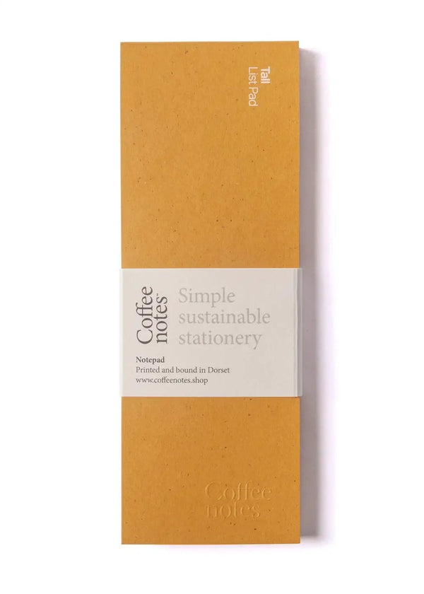 Orange notebook with white label on a white background