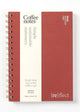 Red notebook with 'Coffee notes' and 'Simple sustainable stationery' text on a white background