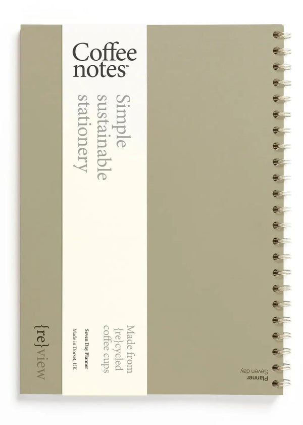 Sustainable stationery planner made from recycled coffee cups on a white background