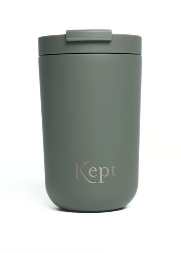 Dark gray tumbler with 'Kept' branding on a white background