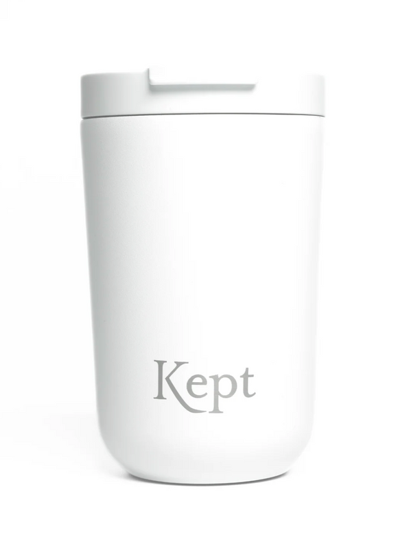 White tumbler with 'Kept' branding on a white background