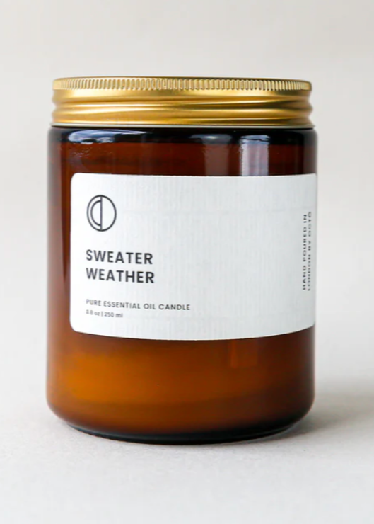 octo winter candle in an amber glass jar