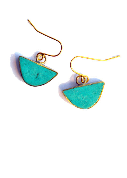 Turquoise earrings with gold hooks on a white background