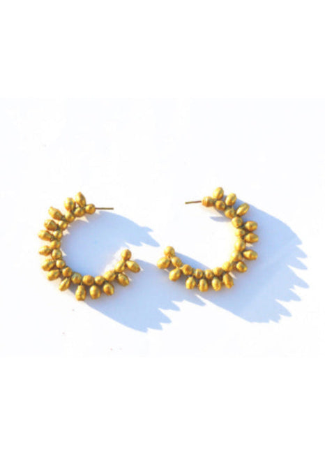 Gold hoop earrings on a white background