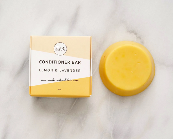Conditioner bar and packaging on a marble surface