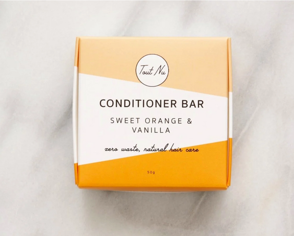 Box of Toot Nu conditioner bar with 'Sweet Orange & Vanilla' flavor on a light background
