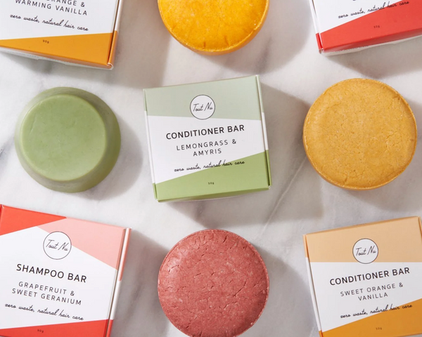 Collection of natural soap bars and packaging on a light background