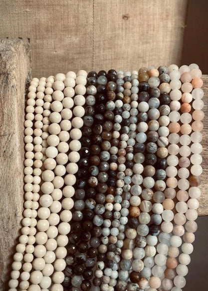 Necklace made of multicolored beads on a wooden surface