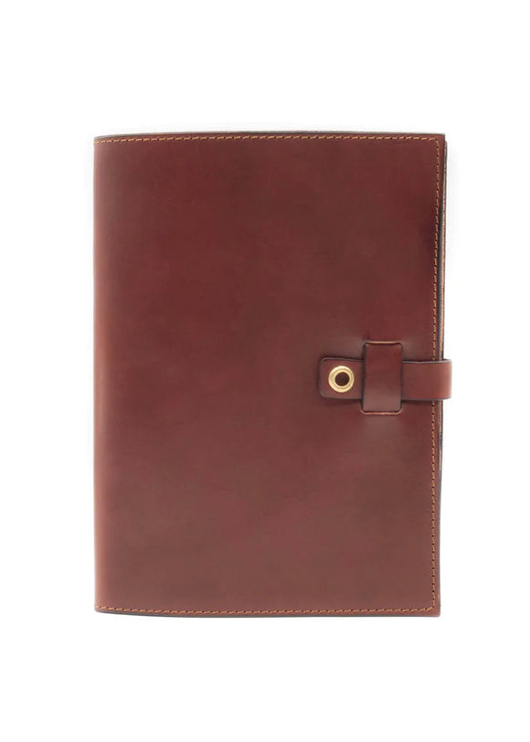 A brown leather notebook with a clasp closure and a visible grain texture, bound in Italian leather.