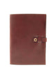 A brown leather notebook with a clasp closure and a visible grain texture, bound in Italian leather.