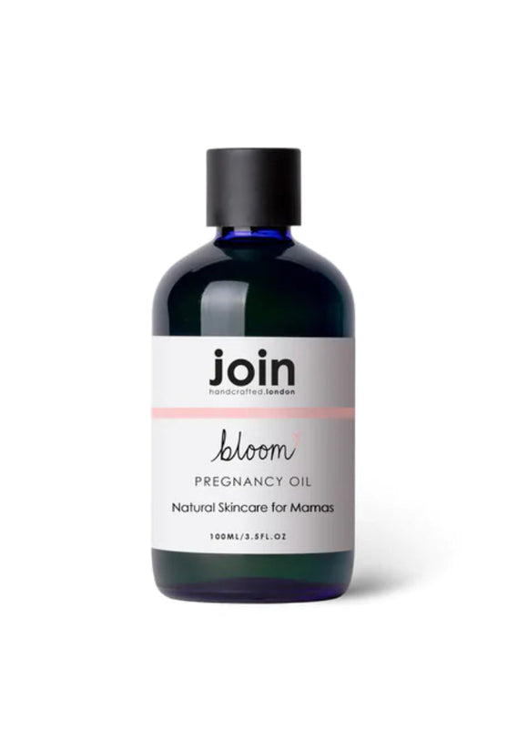 A bottle of Joint Bloom Pregnancy Oil with a label that includes the brand name and product title. The bottle is dark tinted with a black cap.